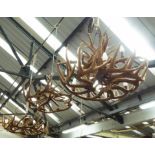 ANTLER STYLE CHANDELIERS, three, one large and two smaller Austrian chalet style, 80cm x 55cm H.