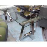 DINING TABLE, by Eichholtz, with glass top on a chromed metal base, 220cm x 90cm x 78cm H.