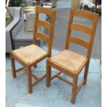 DINING CHAIRS, a set of eight, each with a ladder back and a rush seat, 45cm W x 105cm H.