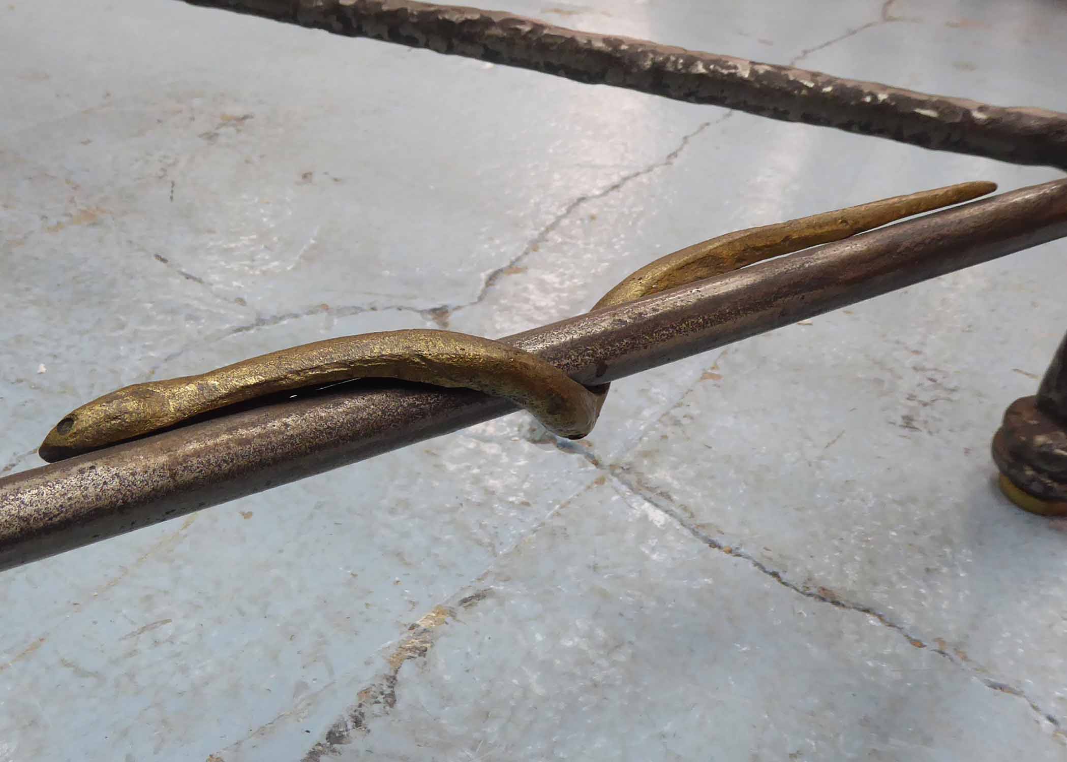 LOW TABLE, Giacometti style, the glass top on a wrought metal base with brass snake detail, - Image 2 of 2