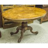 LOO TABLE, mid Victorian burr walnut with oval tilt top on carved pedestal and castors,