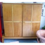 SIDE CABINET, mid 20th century maple and sycamore with two doors enclosing fixed shelves,