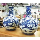 BOTTLE VASES, a pair, Chinese style blue and white, 54cm H.