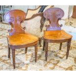 HALL CHAIRS, a pair, William IV mahogany each with cartouche scroll back.