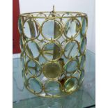 HANGING LIGHT, circular gold metal with rows of individually magnified glass roundles,