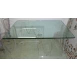 DINING TABLE, the glass top on a two perspex base of jagged form, 107cm x 152cm x 77cm H.