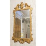 WALL MIRROR, George II giltwood circa 1730 with scrolled decorative detail and bevelled plate,