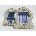 SILVER PHOTOGRAPH FRAMES, a pair, of cartouche shaped chased silver frames, 29cm H.