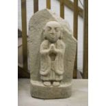 SCULPTURE OF A MONK, an early Chinese, in carved stone, 59cm H.