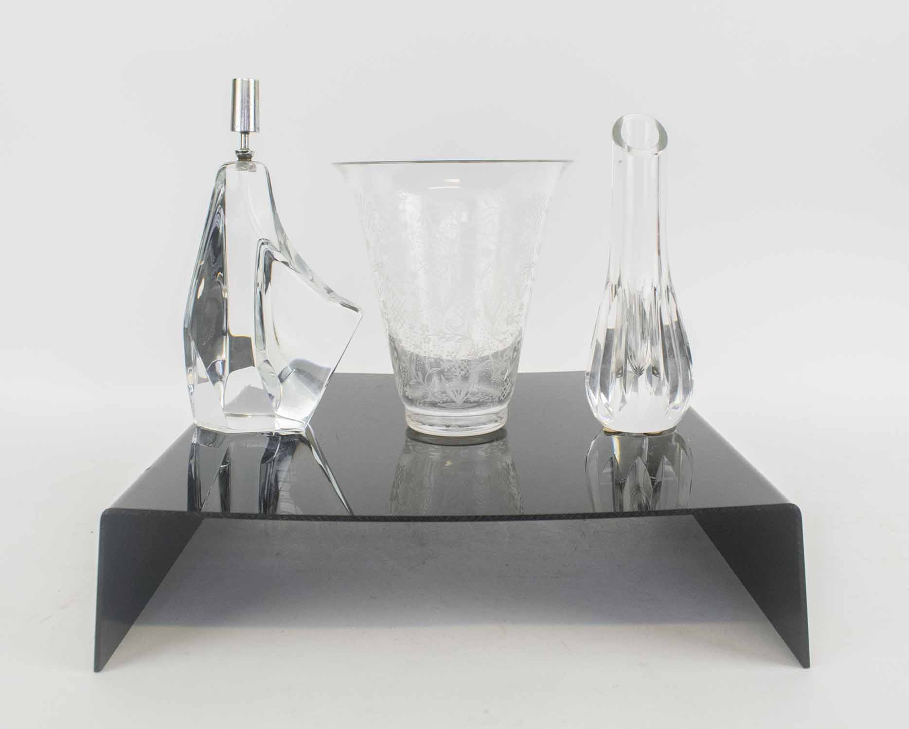 BACCARAT, an antique etched glass vase, a Baccarat stem vase and a Daum candlestick.