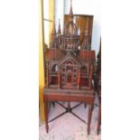 BIRDCAGE ON STAND, red and black the stand on turned supports joined by an X stretcher, 190cm H.