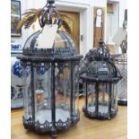 STORM LANTERNS, graduated pair, Georgian design, lined concave glass, metal frames, largest 56cm H,