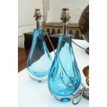 TABLE LAMPS, a pair, blue glass of shaped form, 39cm H.