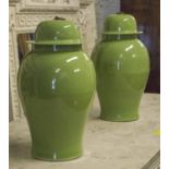 TEMPLE JARS, a pair, Chinese apple green ceramic of ginger jar form with lids, 45cm H.