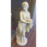 ALABASTER FIGURE, of a Female holding flowers on a circular platform base, 81cm H.