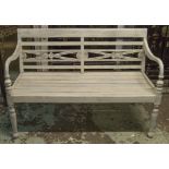 COLONIAL STYLE BENCH, traditionally white painted with carved back, slatted seat and scroll arms,