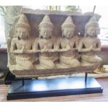 CARVED STONE ASIAN FIGURES, four, praying on a stand, 65cm x 58cm H.