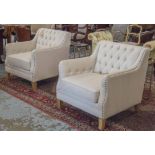 ARMCHAIRS, a pair, club style button backed and brass studded parchment cotton upholstered.