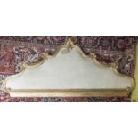 HEADBOARD, with a shaped carved gilt frame, upholstered in calico, 107cm H x 230cm W.