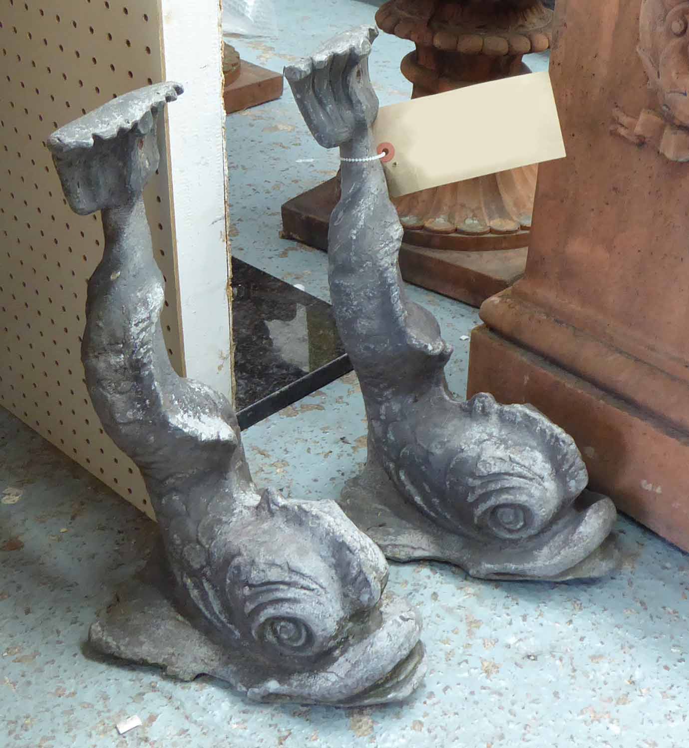 LEAD DAUPHIN, a pair, 38cm H x 22cm L.