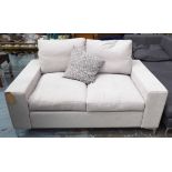 LONDON SOFAS, two seater, of smaller proportions, on polished metal feet, 155cm W.