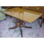 BREAKFAST TABLE, Regency mahogany with rounded rectangular tilt top on pedestal and brass castors,