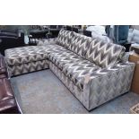 CORNER SOFA, in a geometric patterned fabric on block supports, 260cm x 180cm.