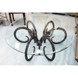 EICHOLTZ COFFEE TABLE, circular glass top on three metal antelope head base, 130cm W x 49cm H.