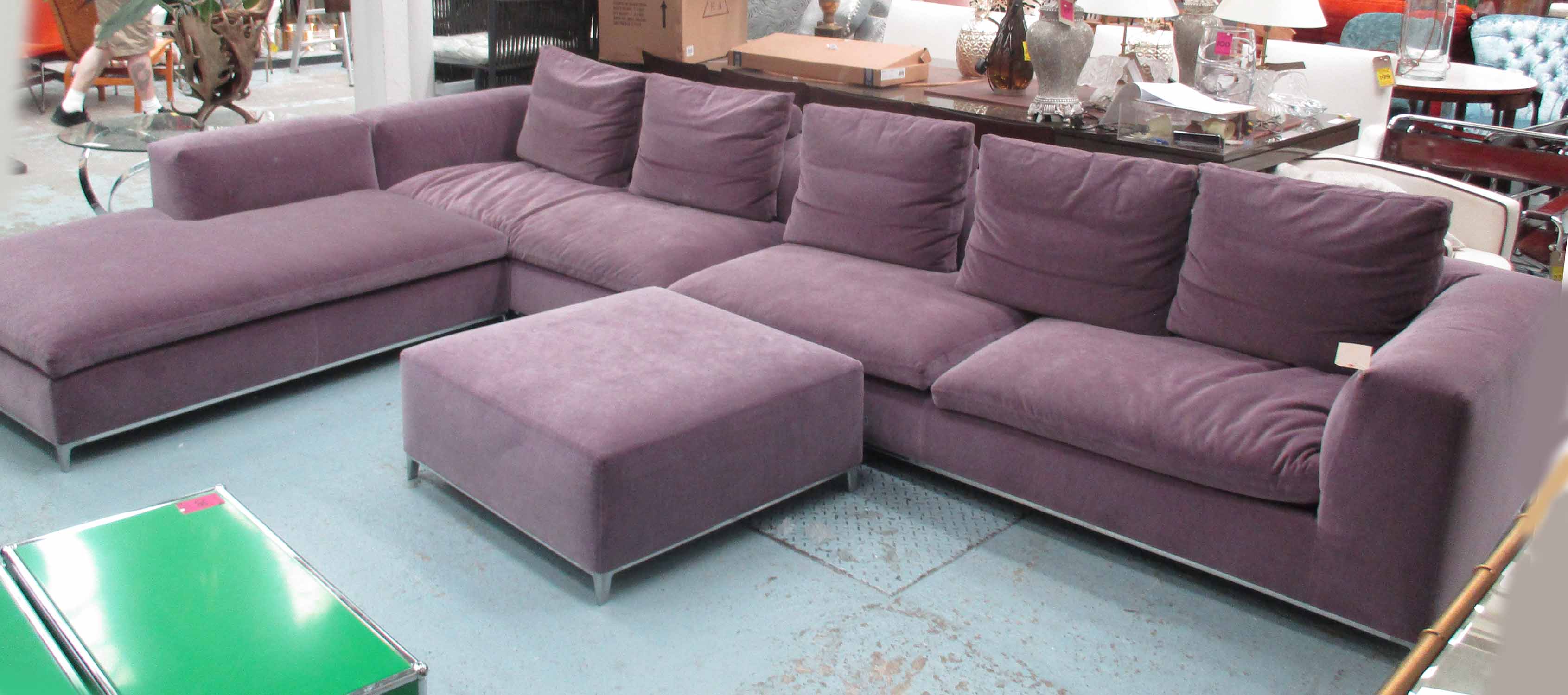 B&B ITALIA CORNER SOFA, in violet faux velvet fabric on metal supports,