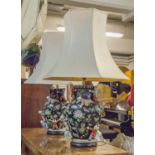 TABLE LAMPS, a pair, Chinese famille noir adorned with climbing children and cream shades,