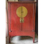 MARRIAGE CABINET, 20th century Chinese red lacquer with two doors enclosing shelf,