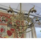 CHANDELIER, late 19th century design brass with six lights (shades lacking) 114cm H x 92cm.