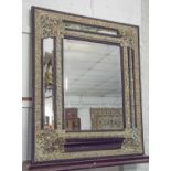 WALL MIRROR, 19th century Dutch repoussé silvered metal with cushion marginal bevelled plates,