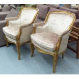 BERGERES, a pair, Louis XV style gilt framed in cream velvet on cabriole front supports,