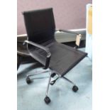 DESK CHAIR, in black leather on a chromed swivel frame on castors, 57cm W.