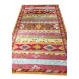 MOROCCAN BERBER RABAT RUG, 250cm x 145cm, in shades of red and ochre.
