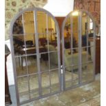 MIRRORS, a pair, Architectural style, metal framed, each with an arched top, 90cm W x 171cm H.
