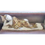 RECLINING THAI FIGURE, alabaster and gilt, 15cm H x 72cm L.