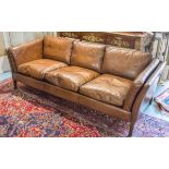 DANISH SOFA, 1970's tan brown leather with three seats and stile supports, 206cm W.