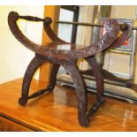 X FRAME STOOL, late 19th/early 20th century mahogany with leaf carved decoration, 64cm W x 55cm H.