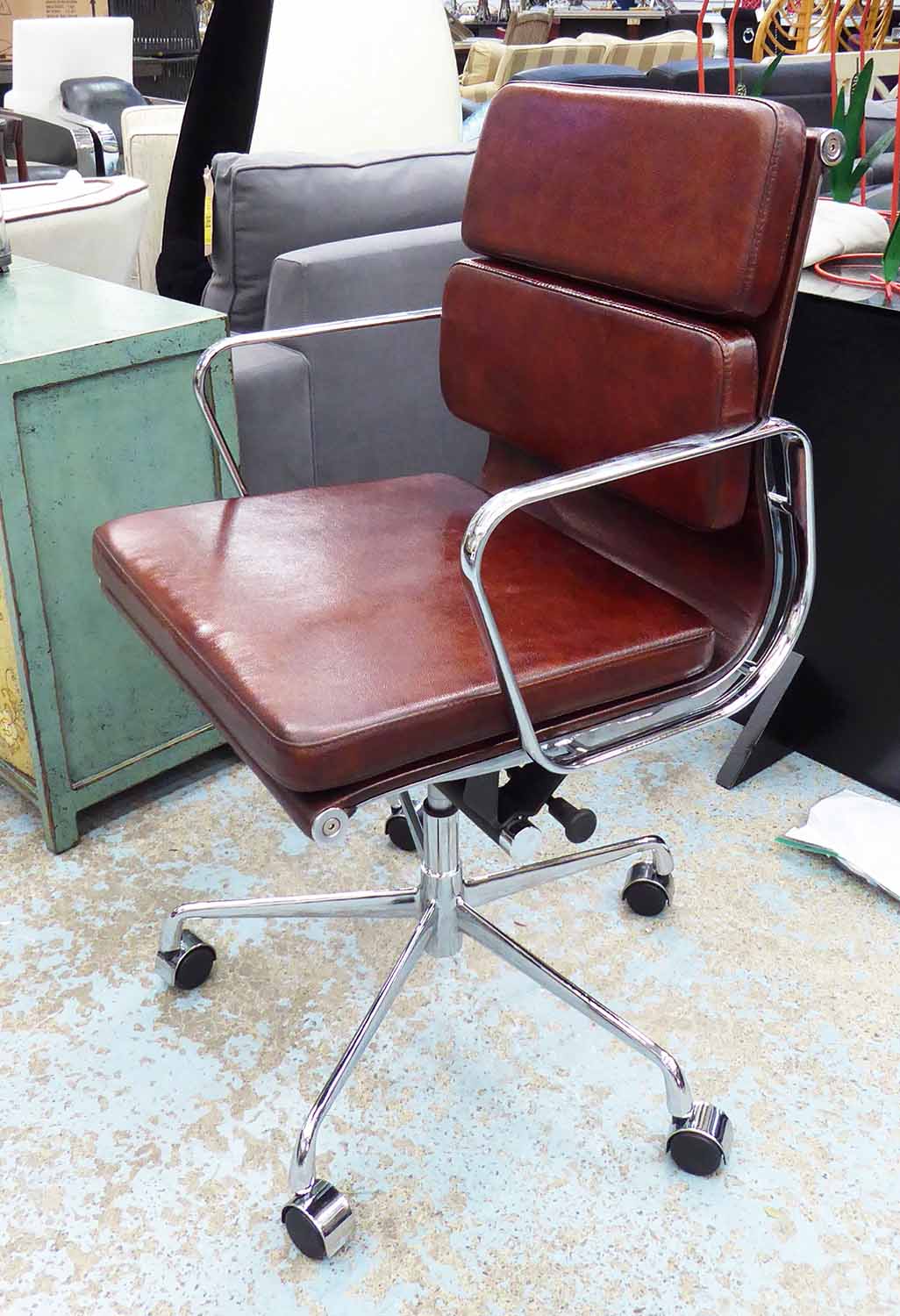 SOFT PADDED DESK CHAIR, after Charles & Ray Eames, hand finished leaf brown leather,