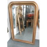 BEVELLED MIRROR, in a gilded frame, 141cm x 89cm.