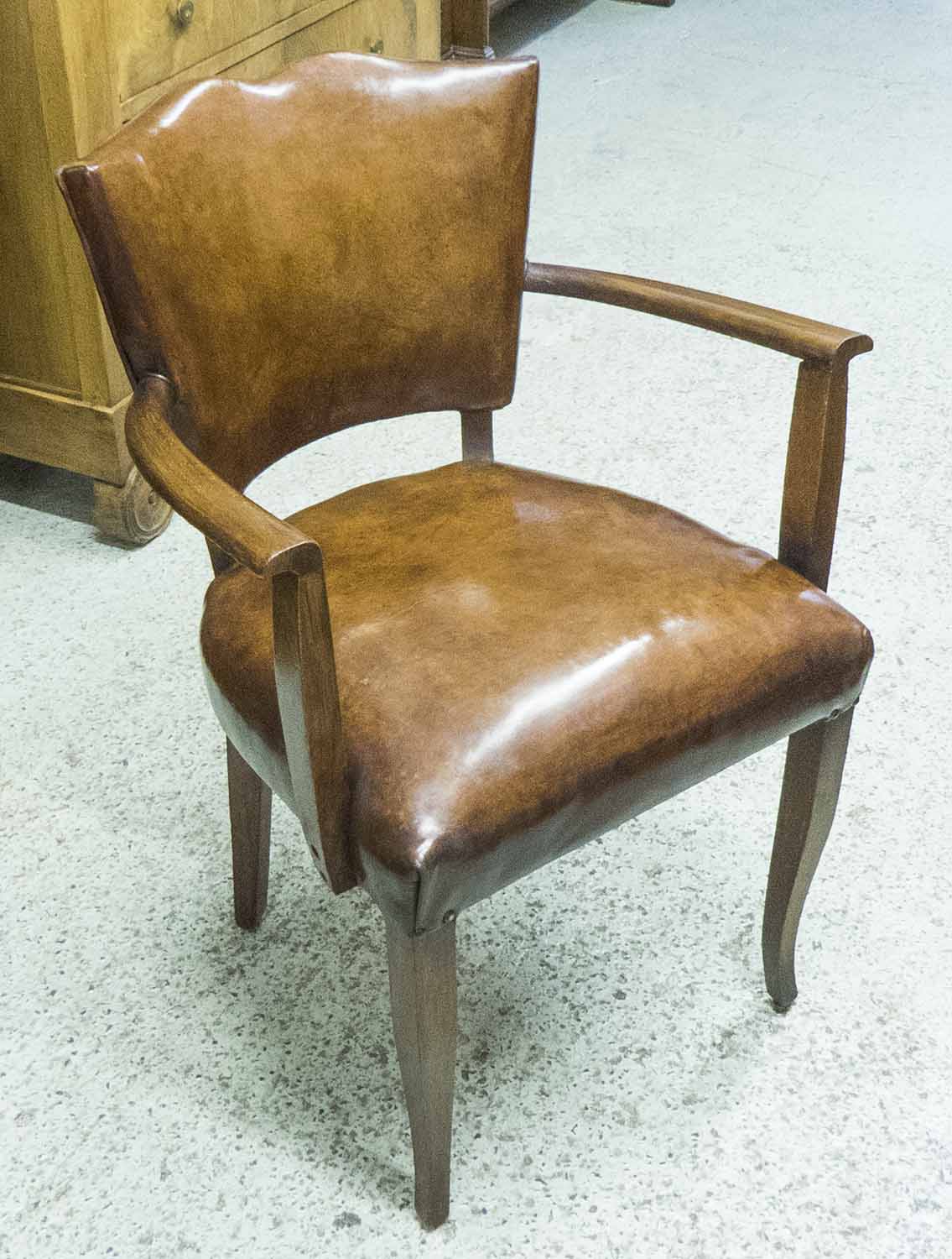 BRIDGE ARMCHAIRS, a pair, Art Deco tan leather upholstered with shaped arms and supports.