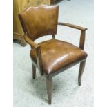 BRIDGE ARMCHAIRS, a pair, Art Deco tan leather upholstered with shaped arms and supports.