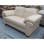 NATUZZI SOFA, two seater, cream leather, 175cm W x 90cm D.