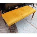 FOOTSTOOLS, a pair, in a gold velvet fabric, on turned fluted supports, 98cm x 39cm x 46cm H.