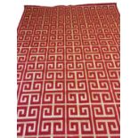 CONTEMPORARY CARPET, 320cm x 228cm, woven gilt and red key design.