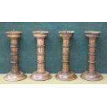 CANDLESTICKS, a set of four, pricket type in turned oak, 46cm H.