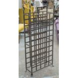 WINE RACK, wrought metal with space for forty five bottles, 131cm H x 57cm W x 21cm D.