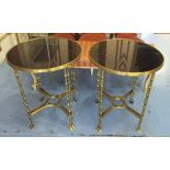 OCCASIONAL TABLES, a pair, gilt metal framed, each with a circular black and speckled top,